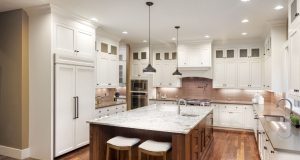 Dining room with a centre island and different lights installed