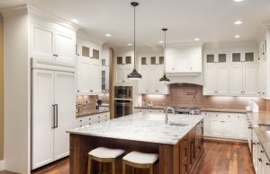 Dining room with a centre island and different lights installed