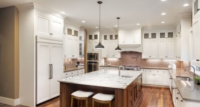Dining room with a centre island and different lights installed