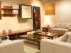 furnished living room with warm white light fixtures