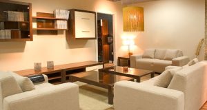 furnished living room with warm white light fixtures
