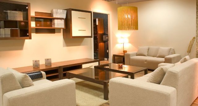 furnished living room with warm white light fixtures