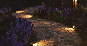 spike lights at the edge of the pavers