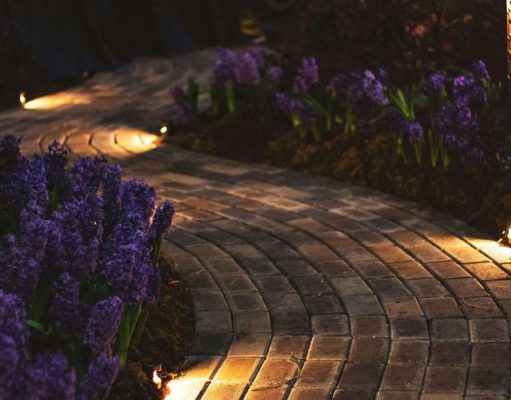 spike lights at the edge of the pavers