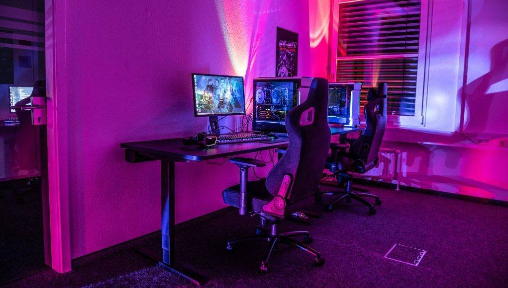 PC gaming setup with red and blue lights.