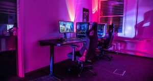 PC gaming setup with red and blue lights.