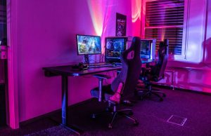 PC gaming setup with red and blue lights.