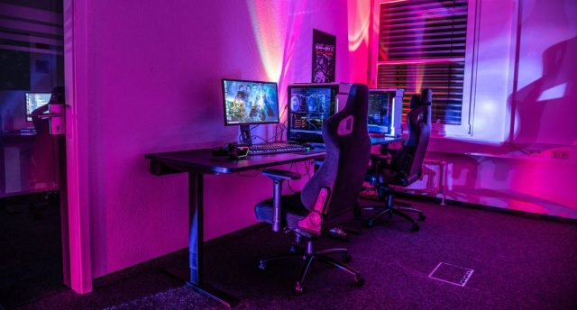 PC gaming setup with red and blue lights.