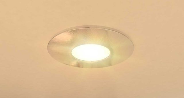 Layering Ceiling, Wall, and Accent Lighting in the Bathroom Single downlight in bathroom ceiling