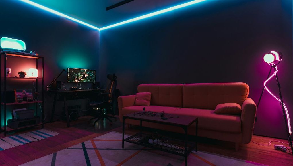 A gaming room with LED neon strip lights.