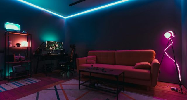 A gaming room with LED neon strip lights.