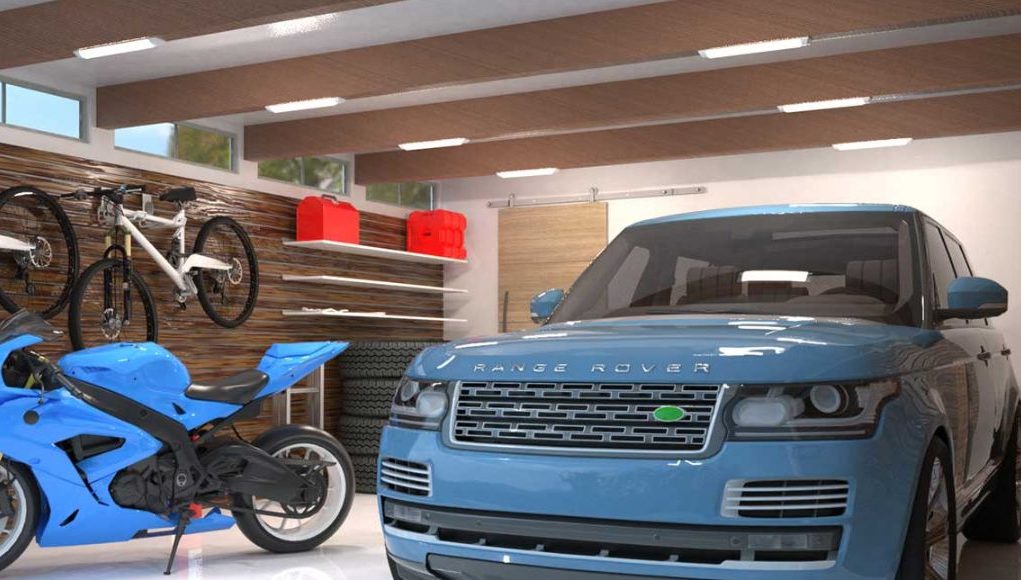 An image of a clean and bright garage with a motorcycle and a car parked inside.