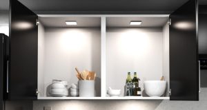Kitchen cabinet illuminated by LED lights