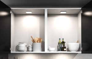 Kitchen cabinet illuminated by LED lights