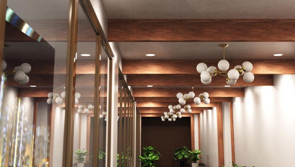 Hallway with exposed wood beams and a series of pendant lights and downlights.