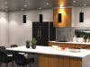 A kitchen with multiple downlight and four pendant lights.