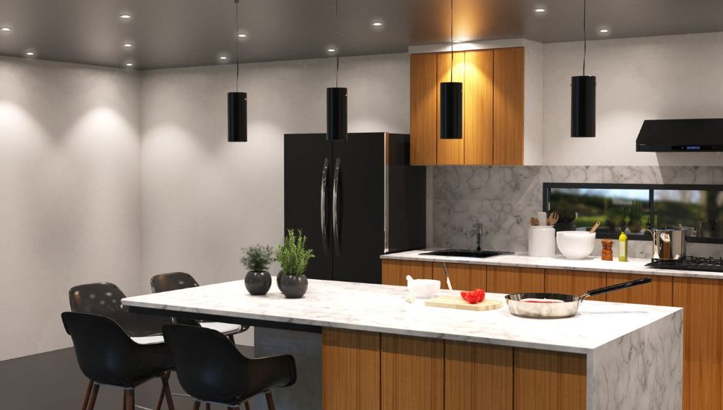 A kitchen with multiple downlight and four pendant lights.