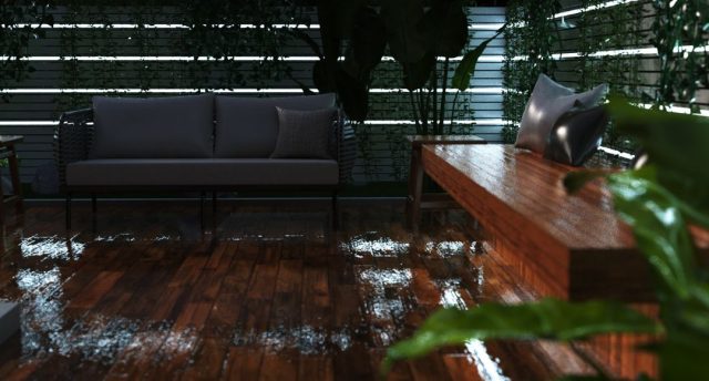 An outdoor deck that's wet from rain with multiple strip lighting on the perimeter wall.