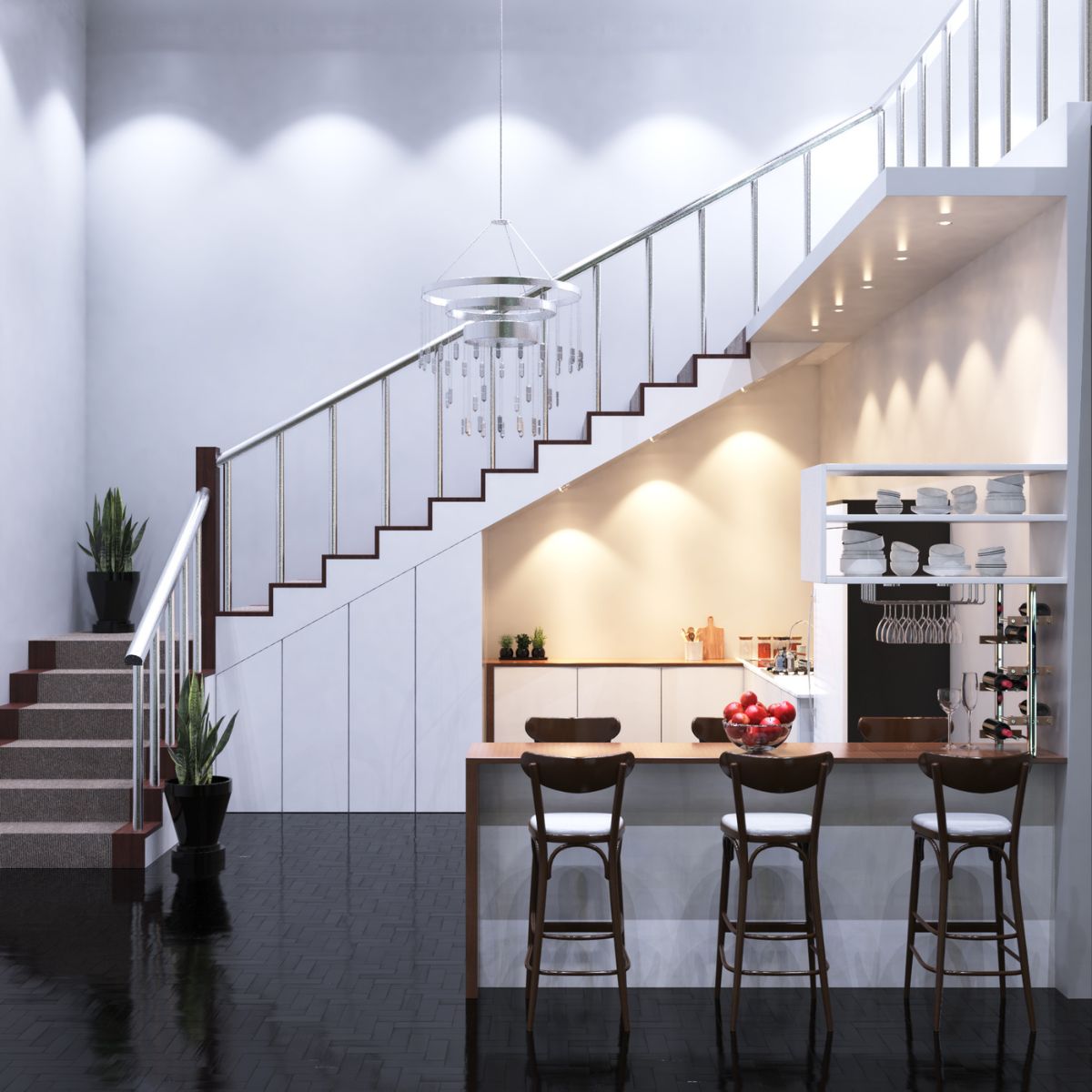 A small kitchen with a bar under a staircase, a hanging chandelier at the center.