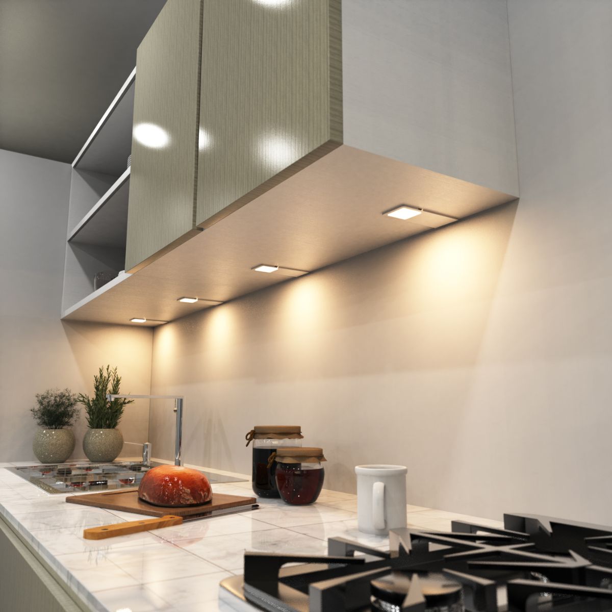A kitchen countertop showing under-cabinet warm lights.