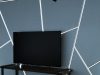 LED Strip Channels & Profiles: How to Install Like a Pro A living room TV with a feature wall with multiple LED strip lights installed in aluminium profiles.