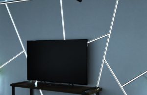A living room TV with a feature wall with multiple LED strip lights installed in aluminium profiles.