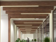 A Safe and Simple Guide to Wiring LED Strip & Power Supplies A hallway with wooden beams with LED strips installed along them.