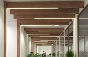 A hallway with wooden beams with LED strips installed along them.