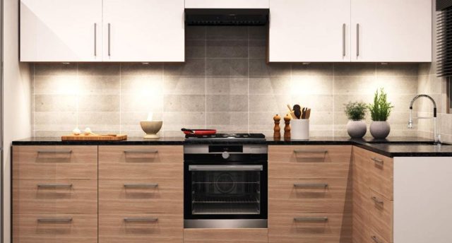 A modern kitchen with wooden cabinets and wall cabinets with lights.