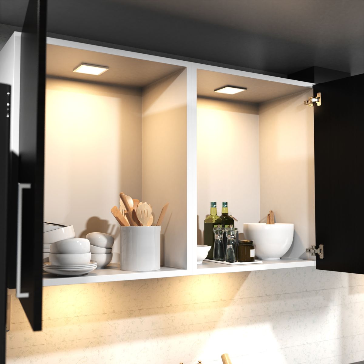 An open kitchen wall cabinet with black doors and inside is lit with an amber LED light.