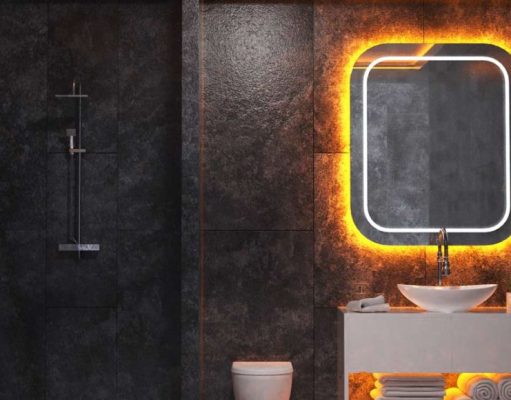 Creative LED Strip Lighting Ideas for Every Room in Your Home A dark bathroom with white sink and a mirror with orange backlighting.