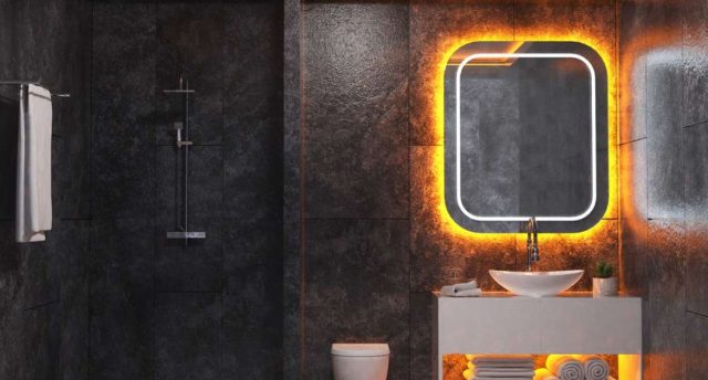 Creative LED Strip Lighting Ideas for Every Room in Your Home A dark bathroom with white sink and a mirror with orange backlighting.