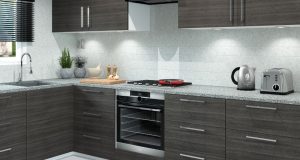 A modern kitchen with dark wood cabinets and white splashback.