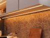 How to Use LED Strip Lights in Your Kitchen A kitchen countertop with visible under-cabinet LED strip lights with a warm glow.