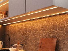 How to Use LED Strip Lights in Your Kitchen A kitchen countertop with visible under-cabinet LED strip lights with a warm glow.