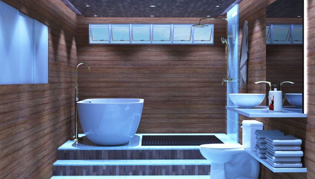 A modern bathroom with wooden walls, an elevated bath and shower, toilet, and sink all visible in single space.