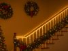 DIY Christmas Lighting Projects with LED Strip Lights A staircase with its hand rail lit up by LED strip lights.