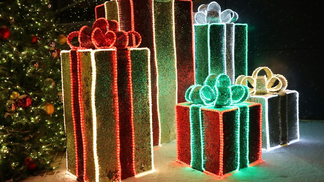 Christmas gift boxes decorations with LED strip lights lining its form.