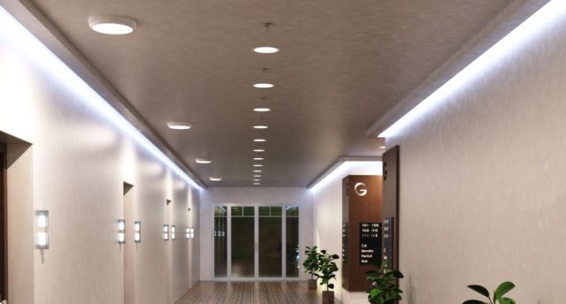 Top Indoor Places to Install LED Bulkhead Lights in Your Home A hallway with multiple round bulkhead lights installed on the ceiling and LED strip lights glowing on both sides