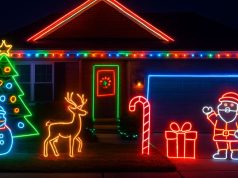 An outdoor Christmas decoration of a home using LED neon lights.