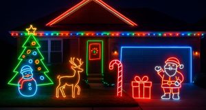 An outdoor Christmas decoration of a home using LED neon lights.