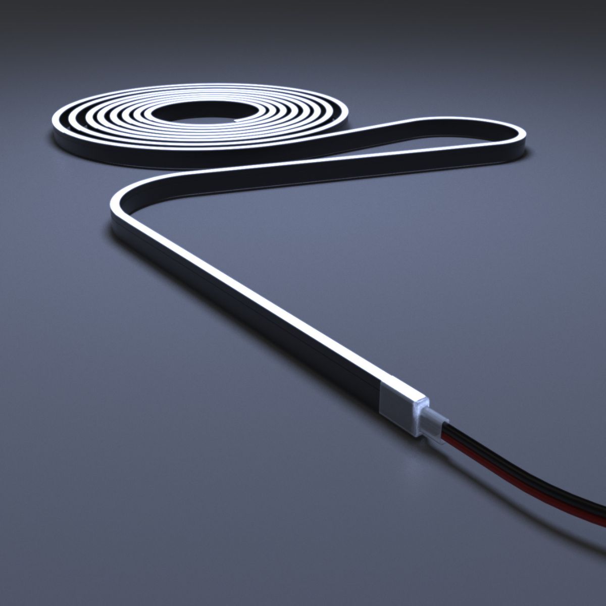 A roll of LED neon flex with a wire connector on a dark surface.