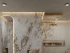 A modern bathroom with marble walls and warm ceiling and mirror lighting.