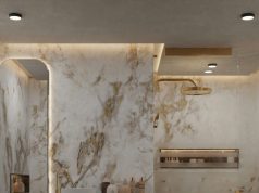 How to Light a Bathroom with No Natural Light A modern bathroom with marble walls and warm ceiling and mirror lighting.
