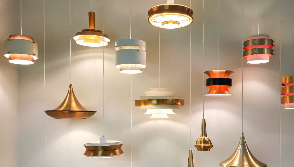 Smart Light 1 Multiple hanging lights illuminating a white wall.