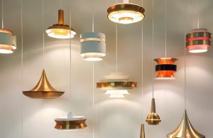 How to Create a Smart Home Lighting System (Beginner’s Guide) Multiple hanging lights illuminating a white wall.