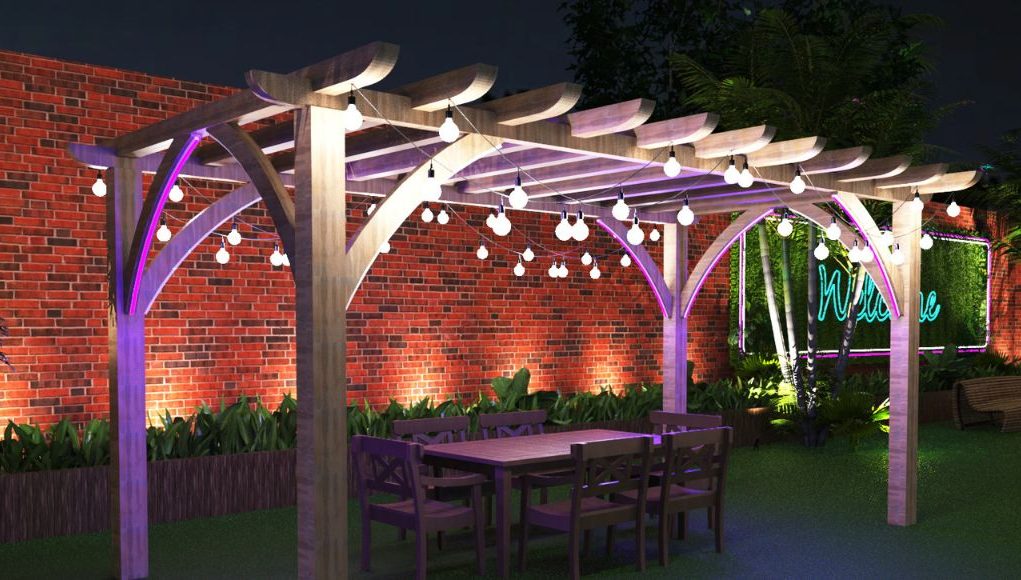 Smart Outdoor 1 A pergola with outdoor lights installed inside a yard with tall brick walls.