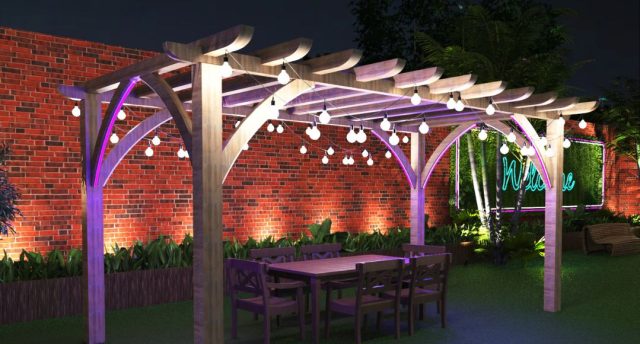 Smart Outdoor Lighting Ideas for Gardens, Pathways & Security A pergola with outdoor lights installed inside a yard with tall brick walls.
