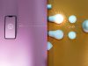 A creative representation of smart lighting with the phone on one side connected through doodles to the bulbs and other devices on the other side.