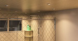 A modern bathroom lit by warm downlights.